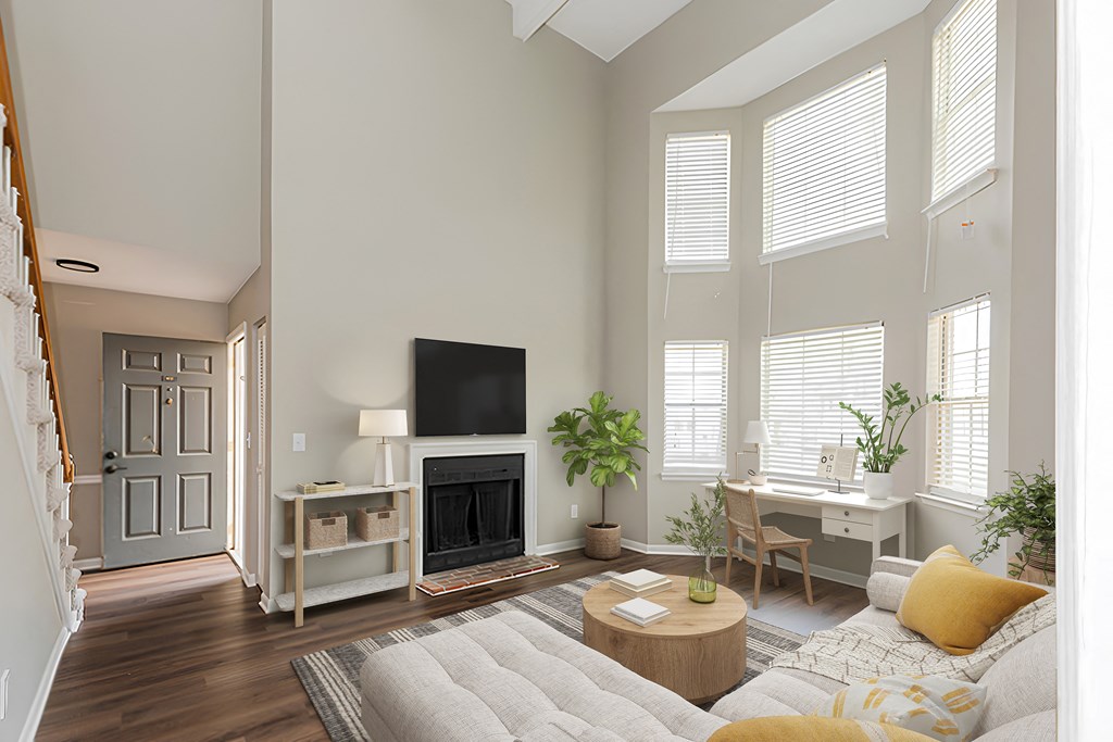 a living room with a couch and a fireplace and a tv