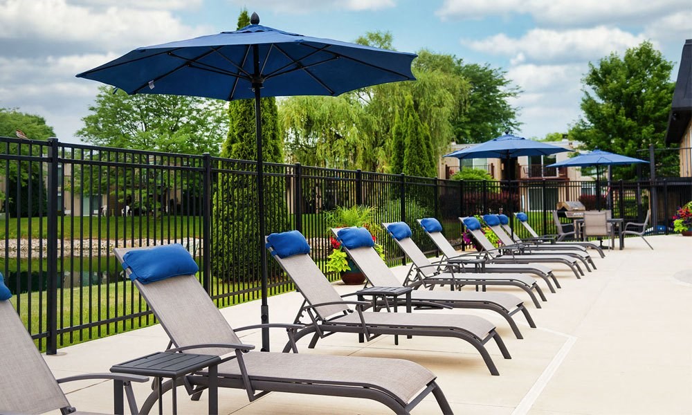 Poolside Sundeck With Relaxing Chairs at Foxboro Apartments, Wheeling, IL, 60090