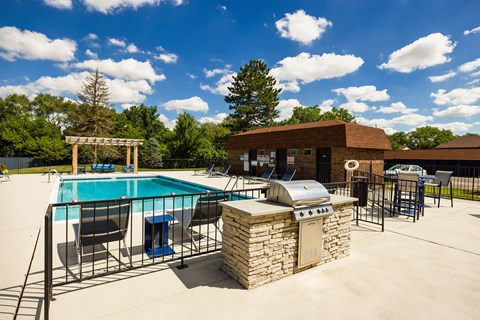 outdoor grilling station near a swimming pool
