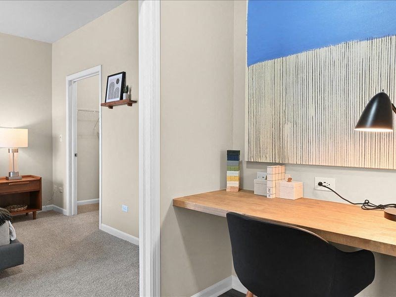 built-in wood desk in an office area near the homes bedroom