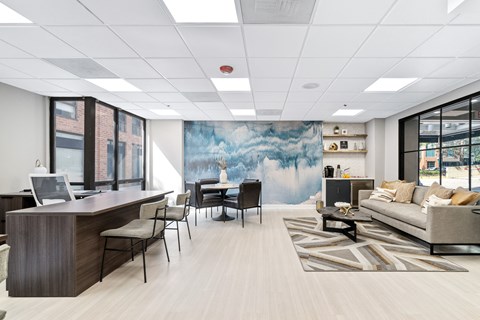 an office space with a large blue mural on the wall