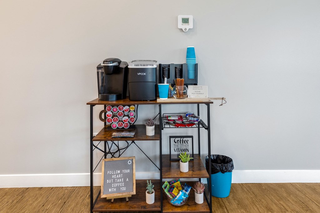 a shelf with coffee machines and other items on it