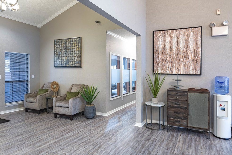 a living room with two chairs and a water heater