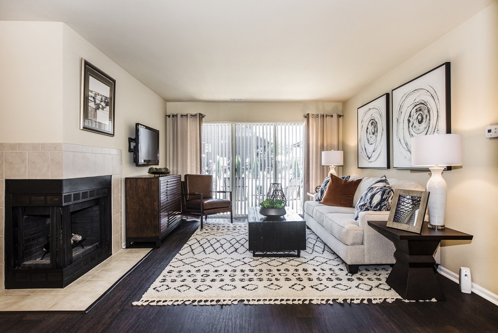 a living room with a fireplace and a couch