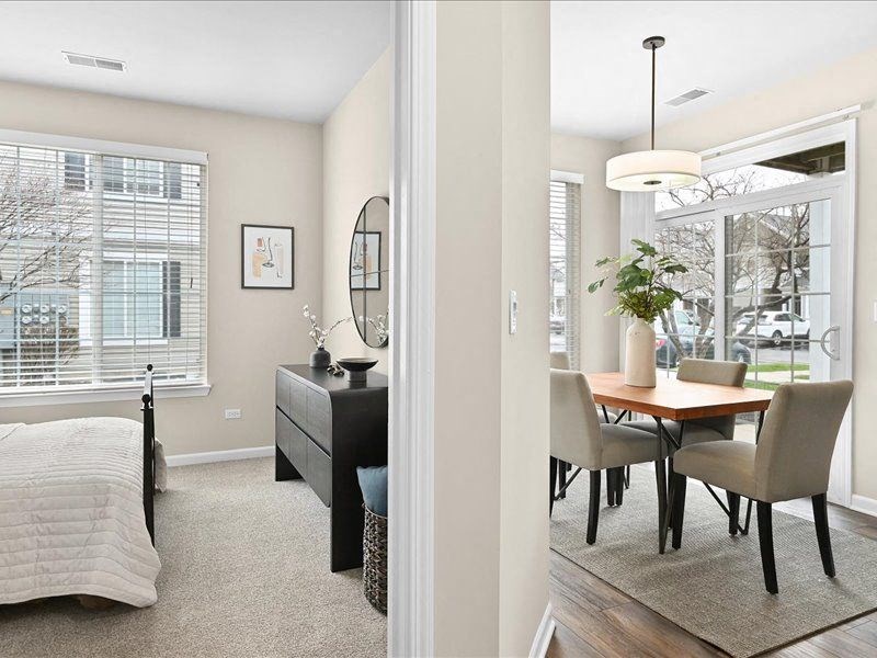 split view into the bedroom and living room of a Farmington Lakes home