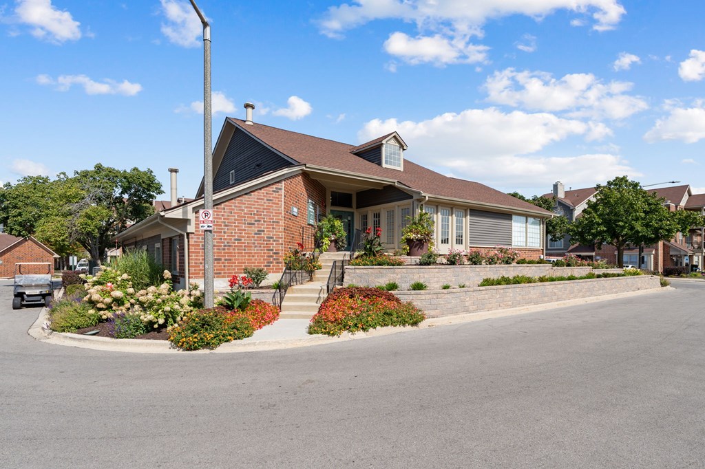 A house with a red brick exterior and a brown roof.