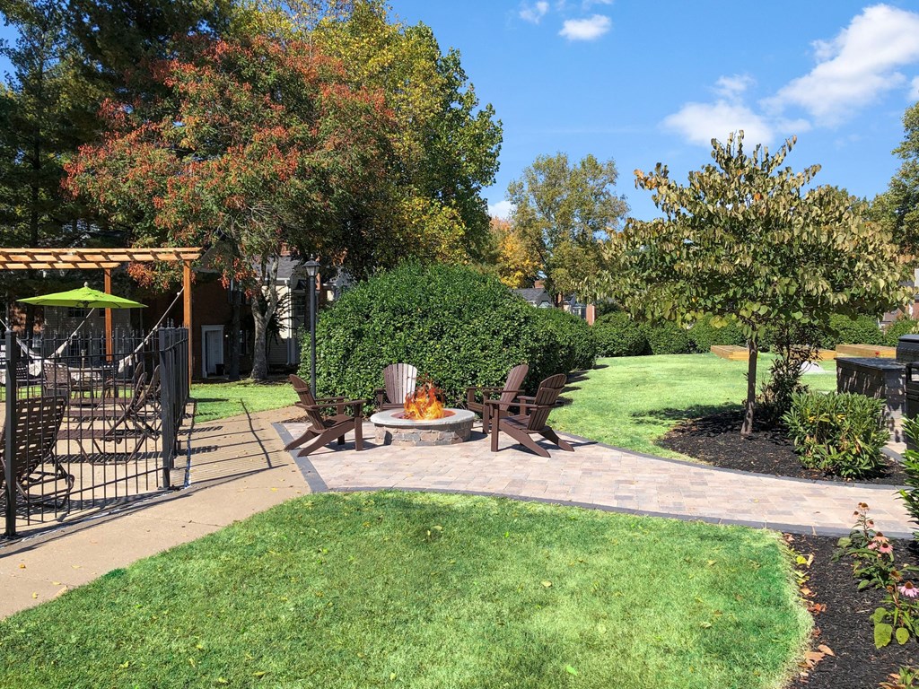 a backyard with a patio and a fire pit