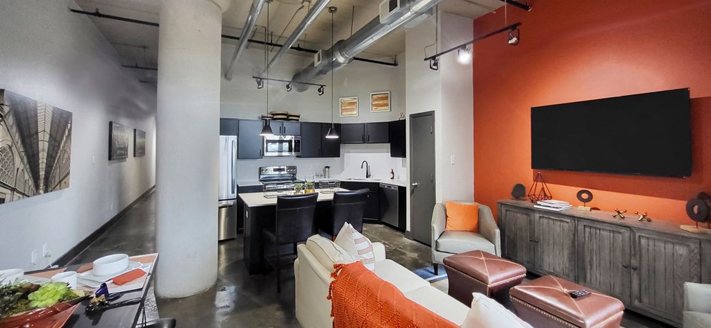 an open floor plan with a kitchen and living room