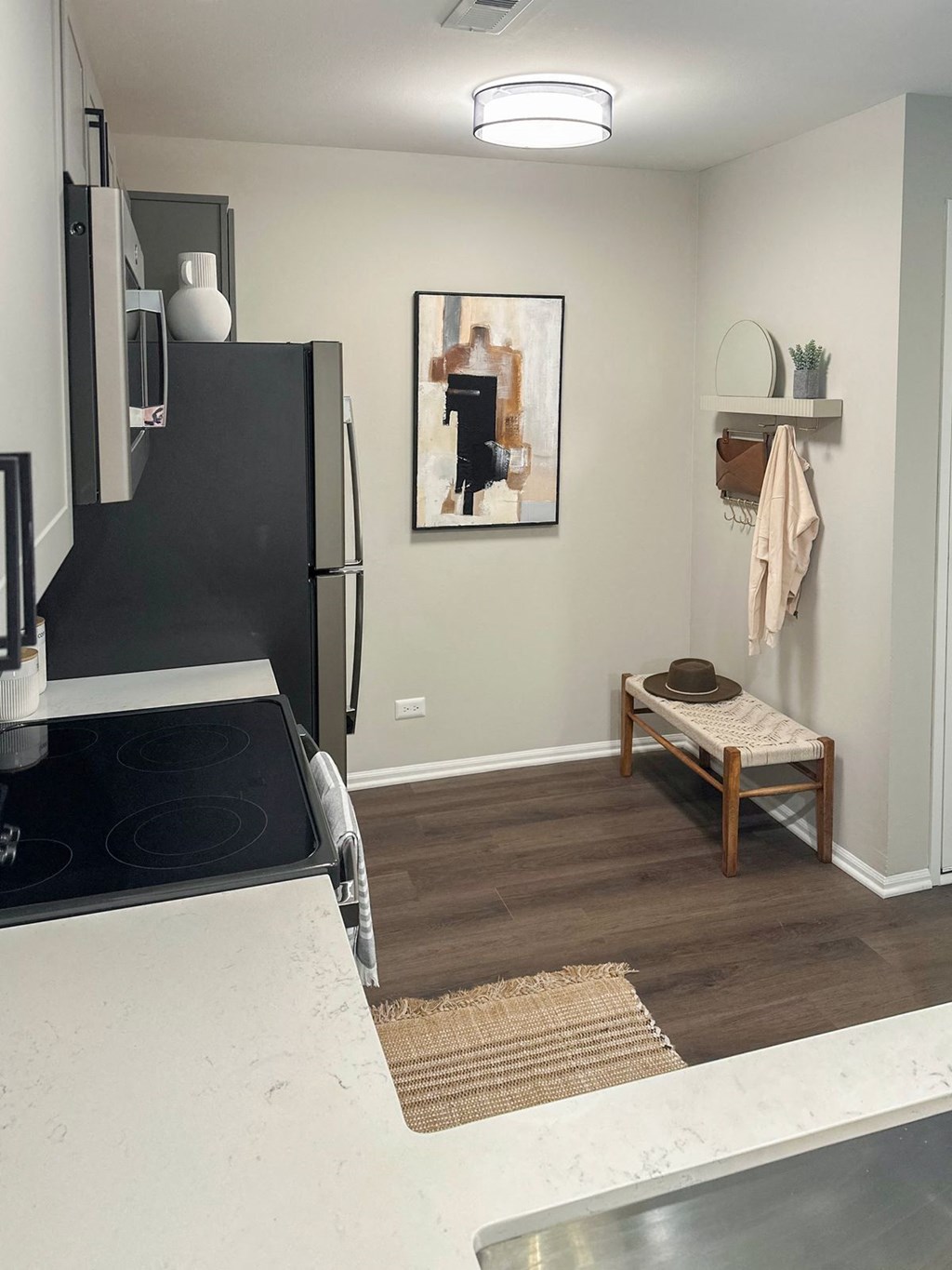 Green Trails apartment kitchen with white countertops