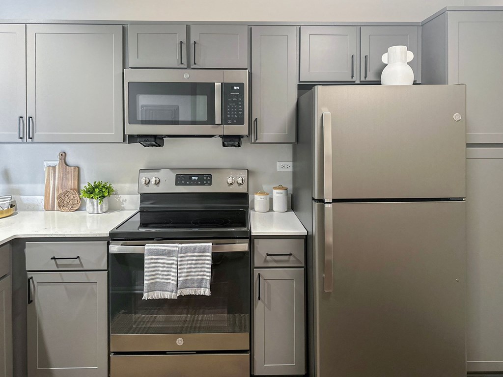 renovated kitchen with gray cabinets