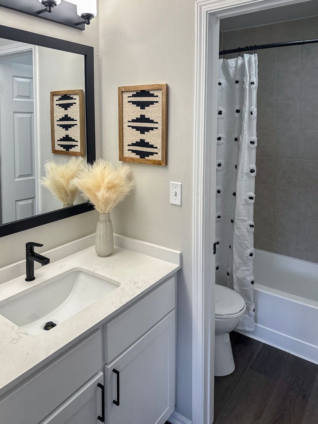 a bathroom with a white sink and a white toilet next to a white bathtub