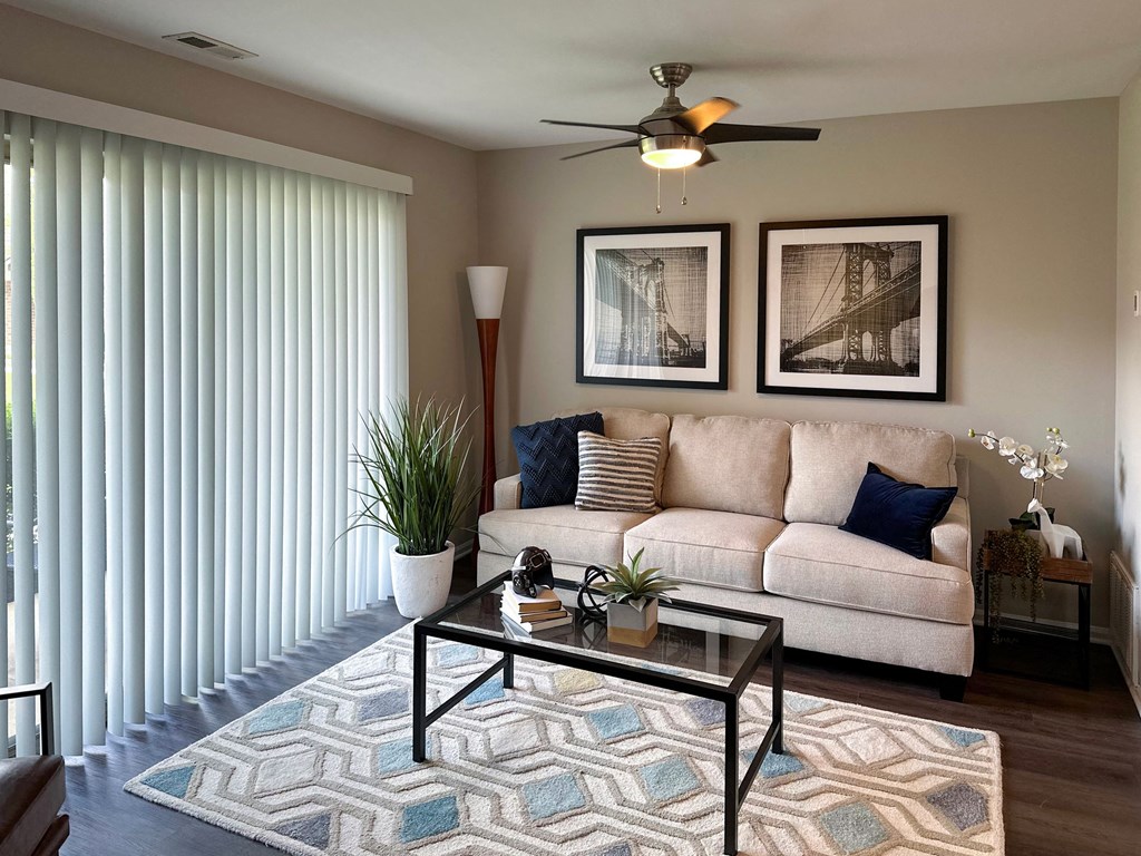 a living room with a couch and coffee table
