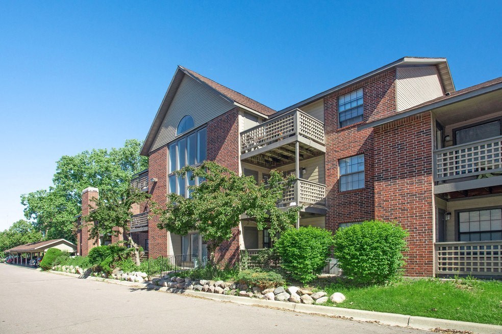 a large brick building with a street in front of it