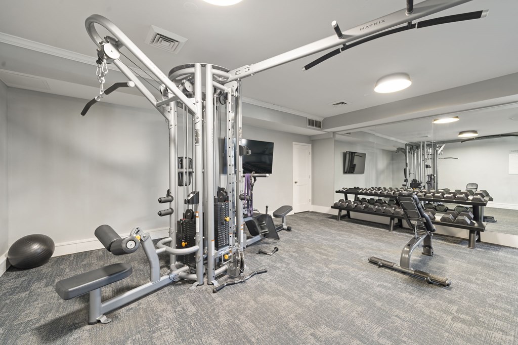 A well-equipped gym with a variety of machines and weightlifting equipment.