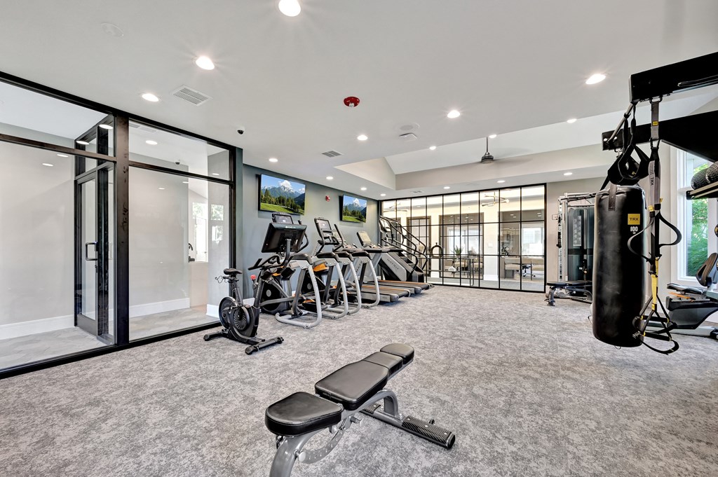 cardio and weight lifting equipment in an expansive fitness center at Farmington Lakes