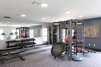 weight equipment in The Addison at Southfield's on-site fitness center