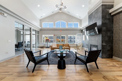 A modern living room with a fireplace and a dining table.