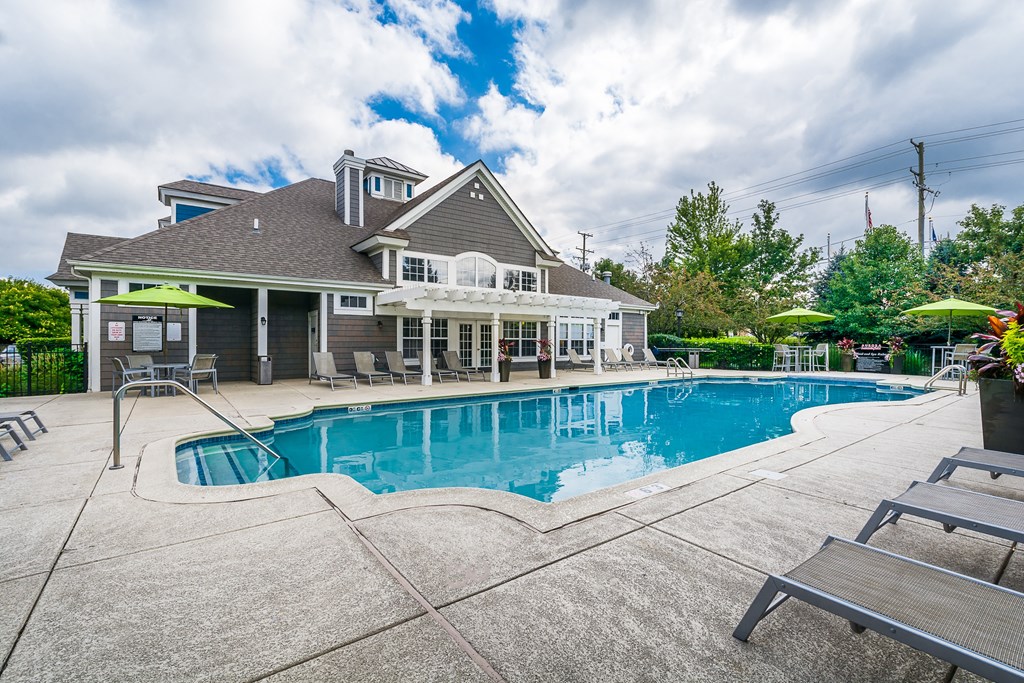 A large house with a pool in the backyard.