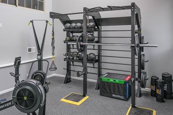 weight machines and equipment in the on-site fitness center at Green Trails Apartments