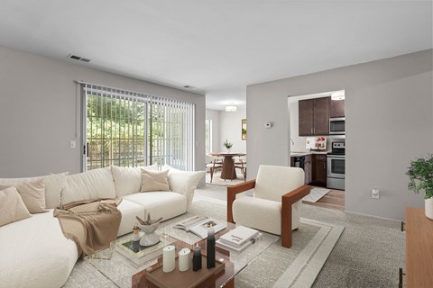 A modern living room with a white sofa and a glass coffee table.