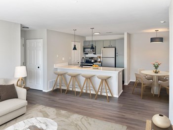 a kitchen and dining area in a 555 waverly unit - Photo Gallery 24