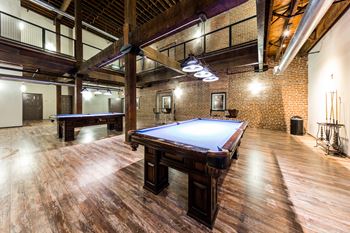 a game room with a pool table