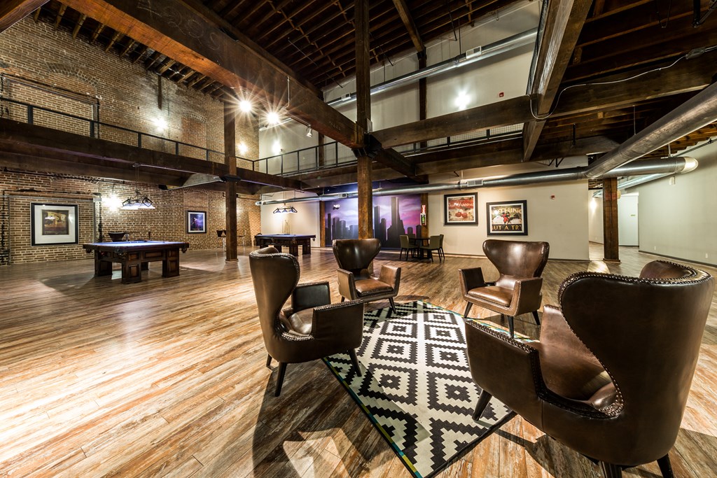 community area with seating and billiards tables at East End Lofts in Houston, Texas