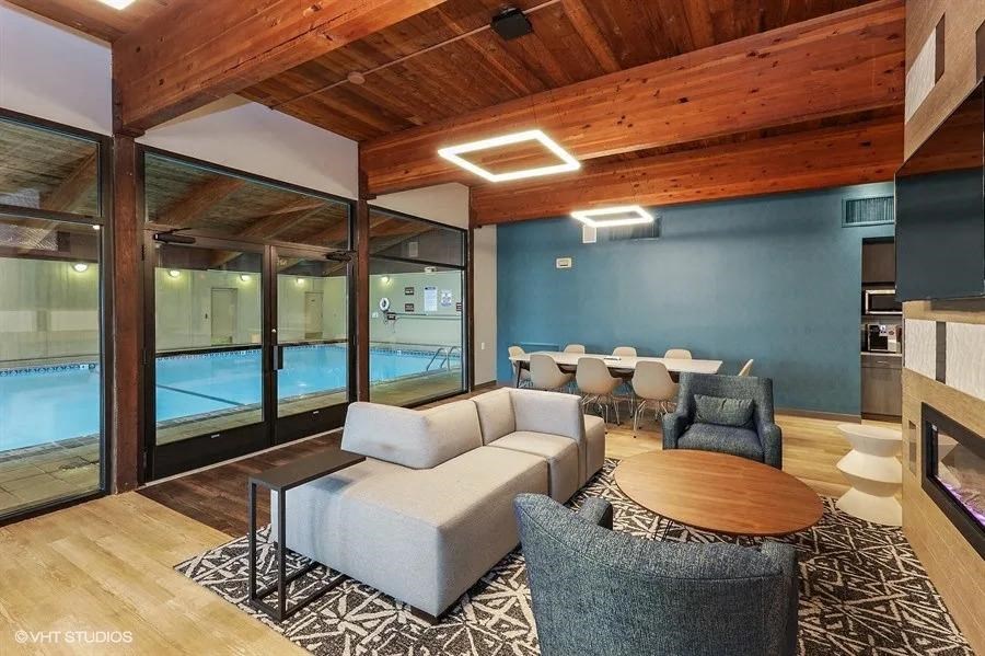 a living room with couches and chairs and a table