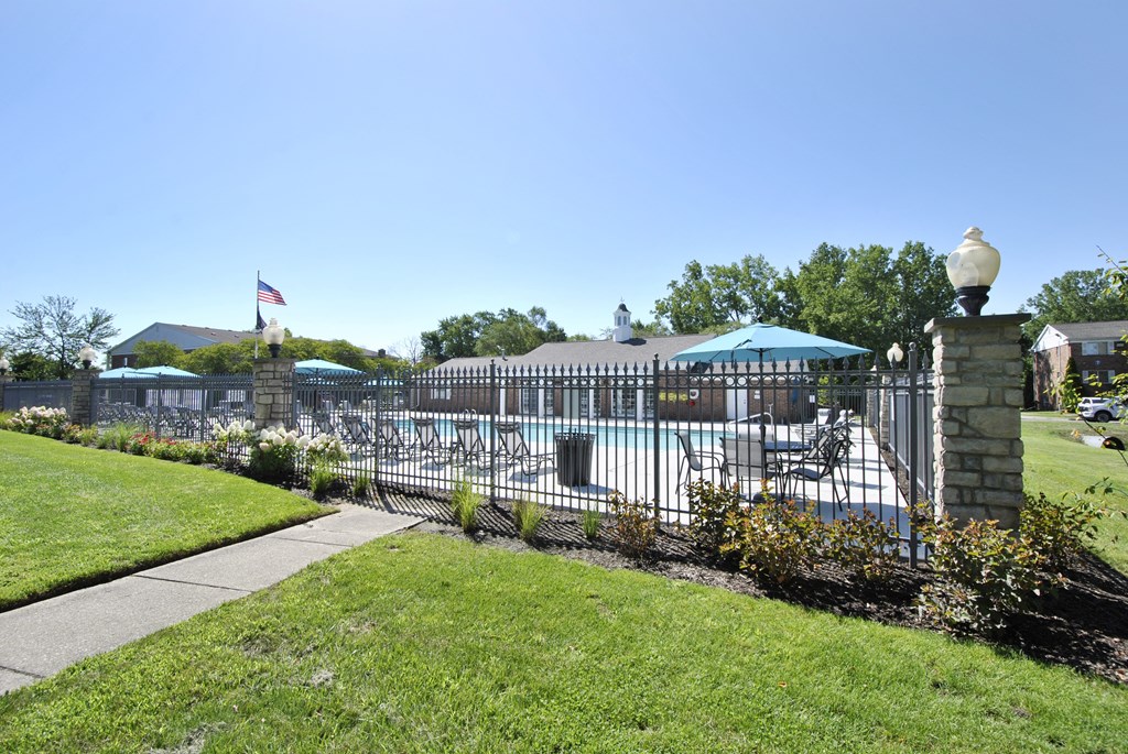 walkway to a fenced-in swimming pool at The Maxwell in Romulus, MI