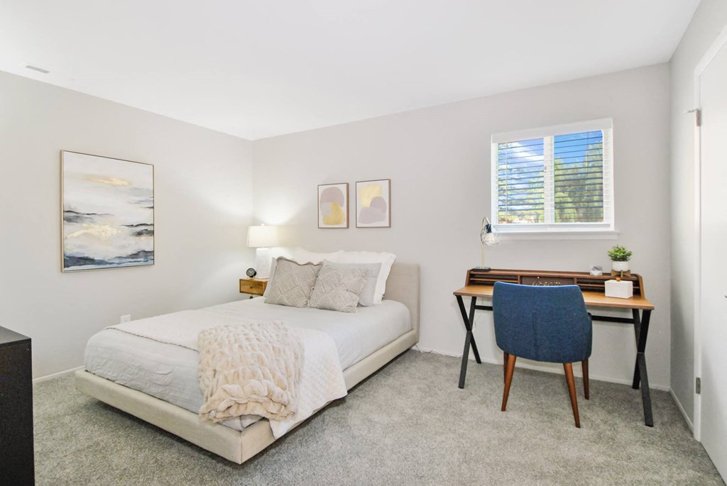 bedroom with neutral colors and ample natural light