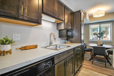 renovated kitchen with brown cabinets