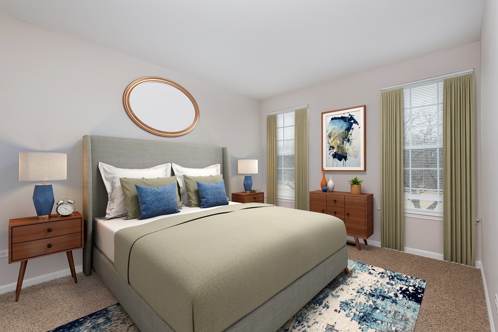 A bedroom with a large bed and a painting on the wall.