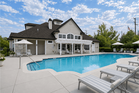 A large house with a pool in the backyard.