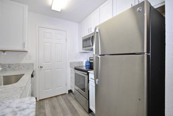 stainless steel appliances in an apartment kitchen