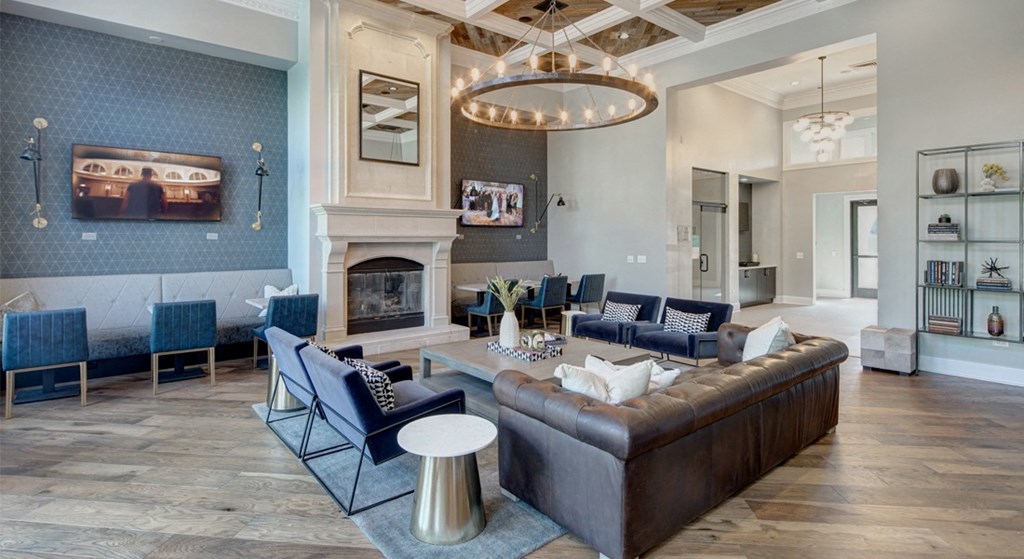 Sofa and chairs by relaxing fireplace - The Mil'Ton Luxury Apartments