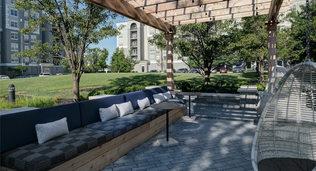 Cozy seating area with tables - exterior of The Mil'Ton in Vernon Hills