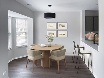 a dining room with a table and chairs - Photo Gallery 25