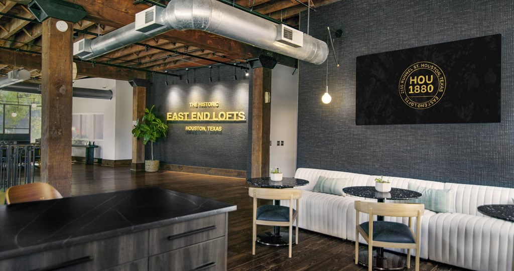 A black and white image of a room with a sign that says "HOU 1880".