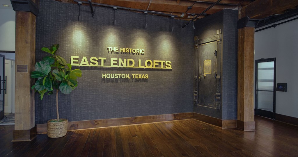 A sign that says "The Historic East End Lofts" is on the wall.