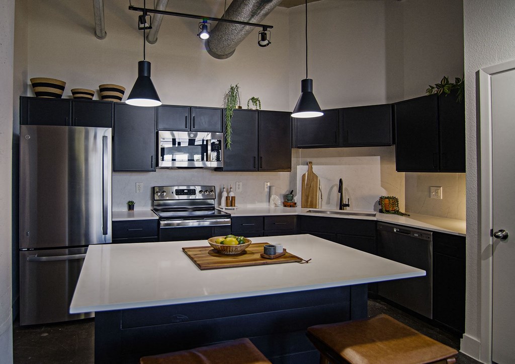A modern kitchen with a large island in the center.