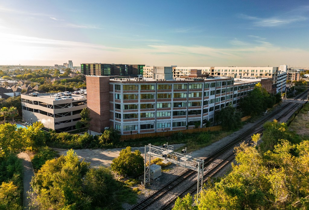 A train station with tracks and a train on the tracks.