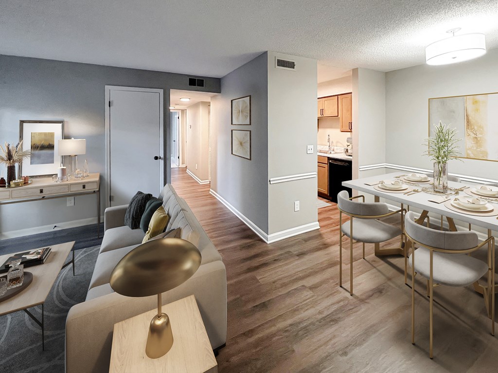 a living room and dining room with a table and chairs