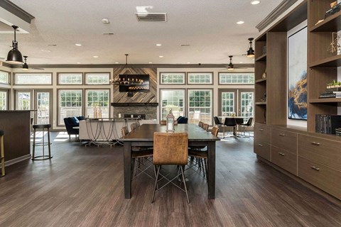 Fairlane Woods Apartments resident clubroom with ample seating and dining areas