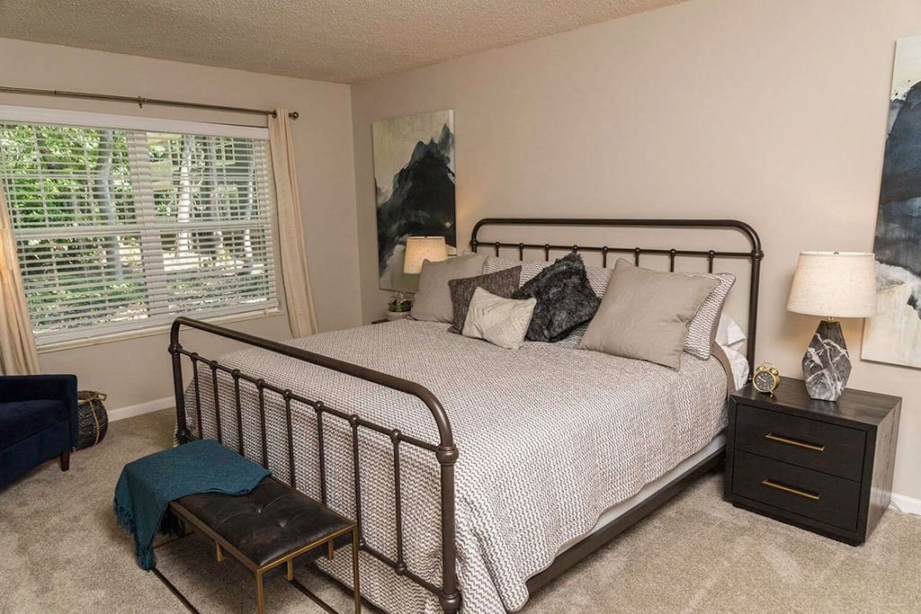 furnished bedroom in a Dearborn apartment at Fairlane Woods