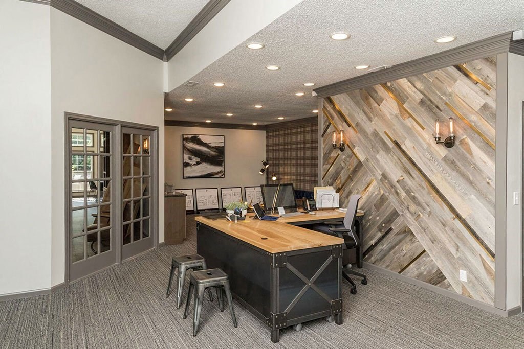 desk in the business center at Fairlane Woods Apartments in Dearborn, MI