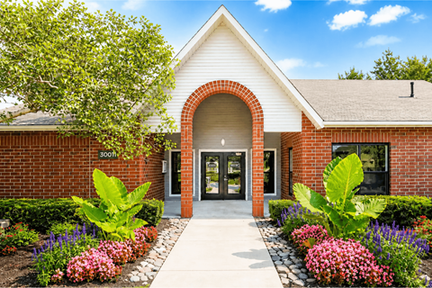 A building with a white roof and a brick archway entrance.