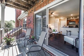 apartment balcony with two chairs
