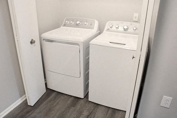 a washer and dryer in a room with a door