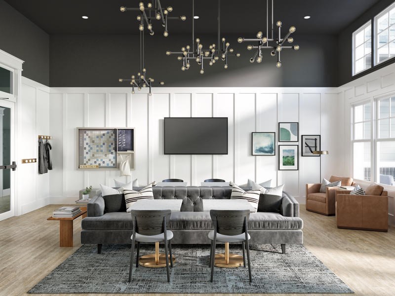 A modern living room with a grey sofa set and a large TV.