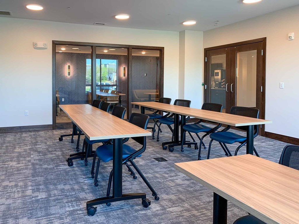 A large conference room with tables and chairs